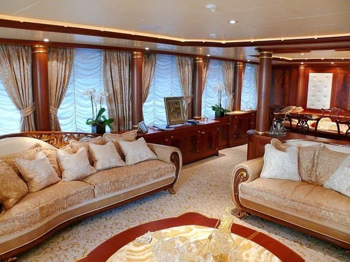 a living room with a couch and a table aboard AQUAMARINA Yacht for Sale