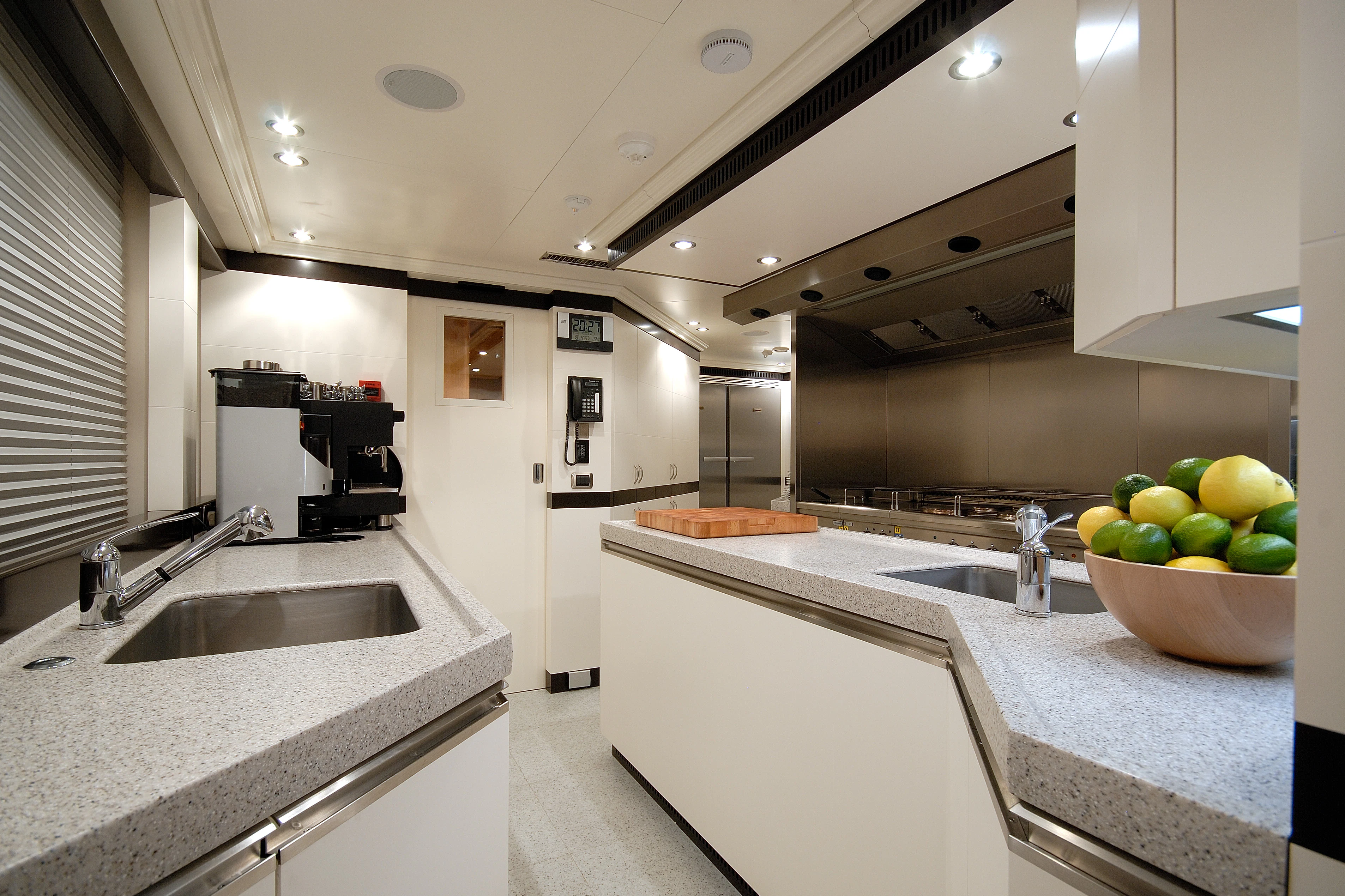 a kitchen with white cabinets aboard AQUAMARINA Yacht for Sale