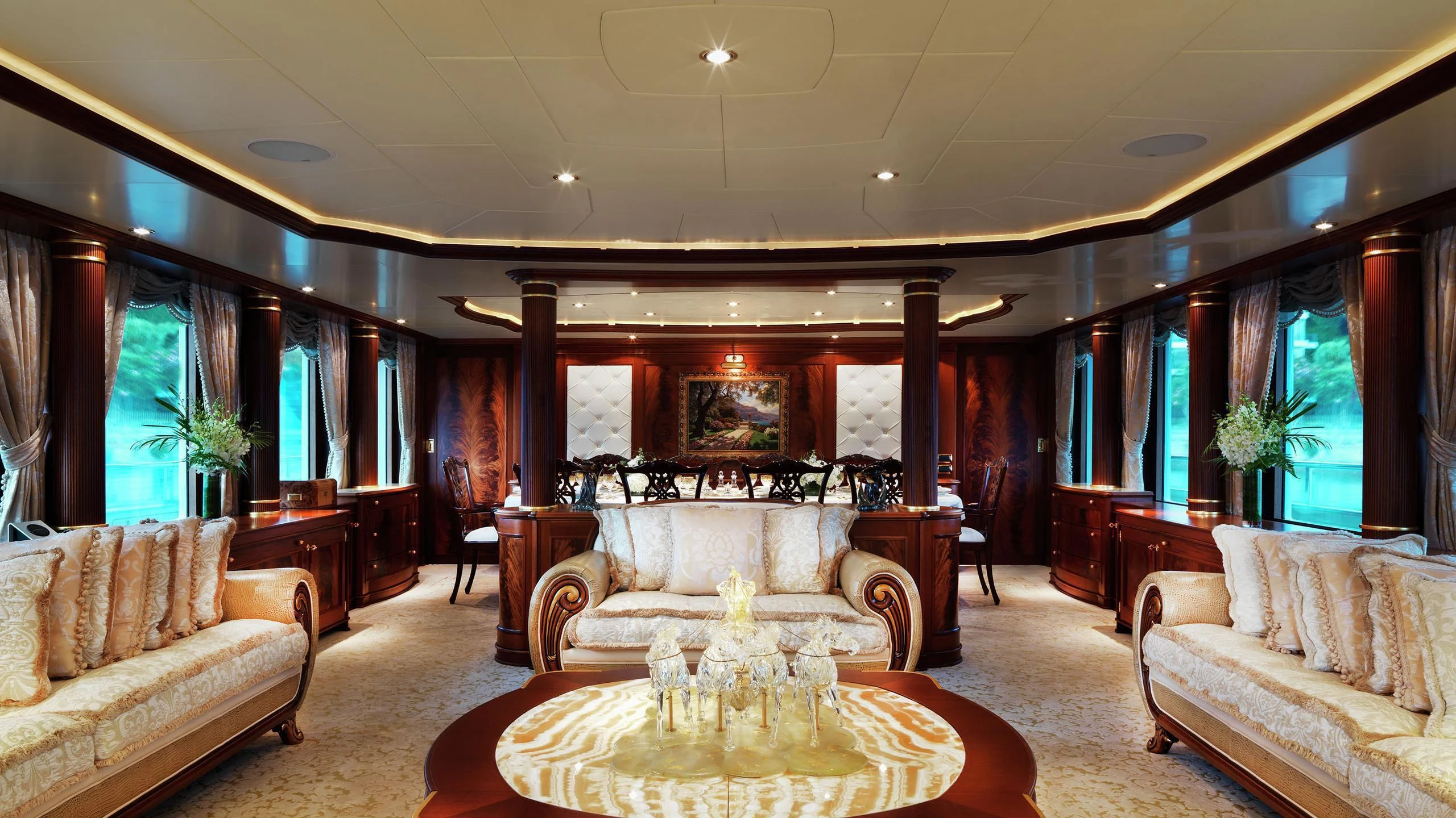 a living room with a large sofa aboard AQUAMARINA Yacht for Sale