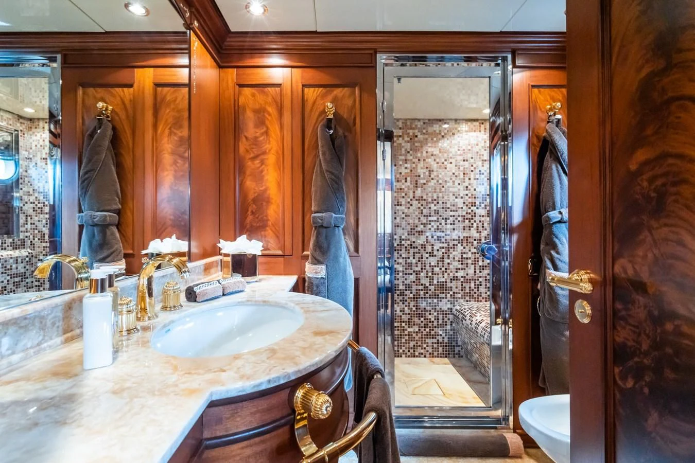 a bathroom with a sink and a mirror aboard AQUAMARINA Yacht for Sale