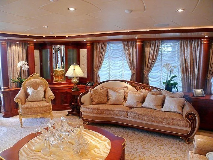 a living room with a couch and a table aboard AQUAMARINA Yacht for Sale