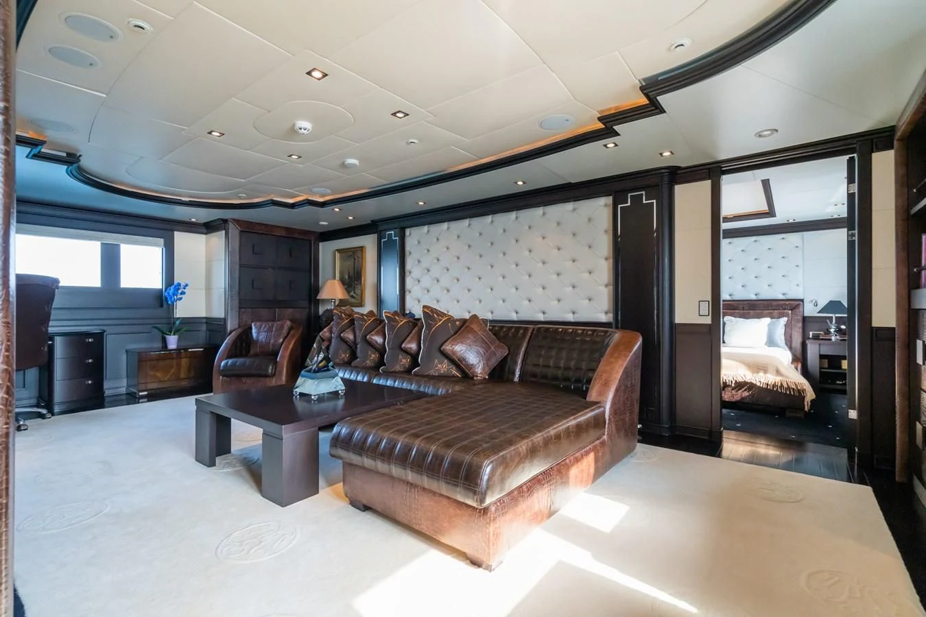 a large living room with a large screen aboard AQUAMARINA Yacht for Sale