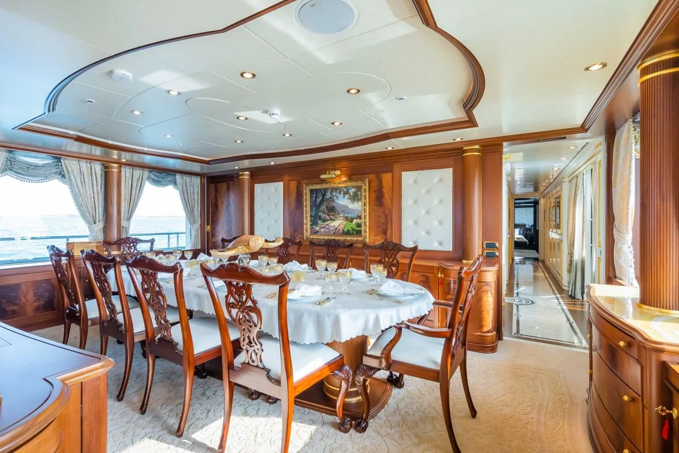 a dining room with a table and chairs aboard AQUAMARINA Yacht for Sale