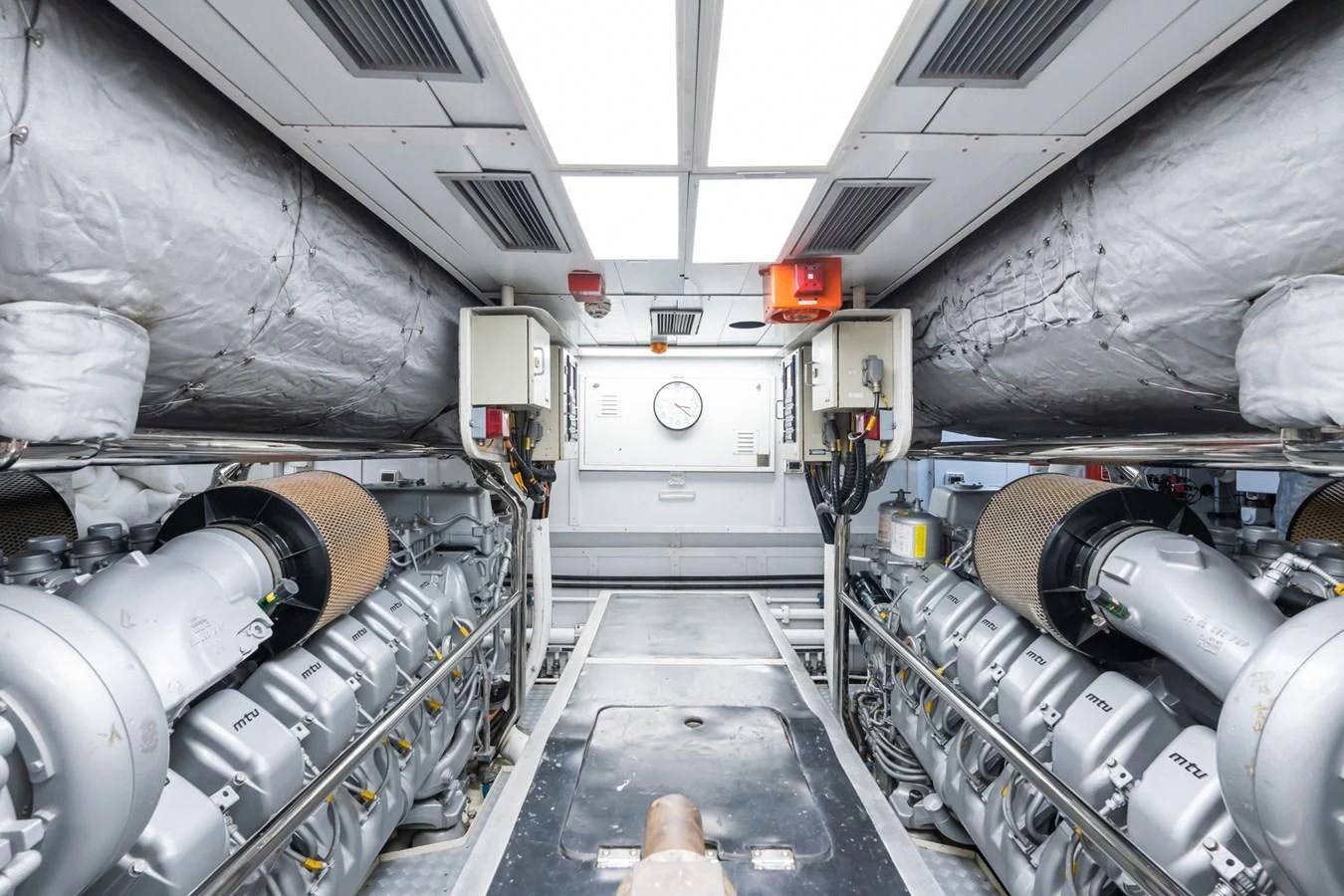 a large white machine with a large metal cylinder aboard AQUAMARINA Yacht for Sale