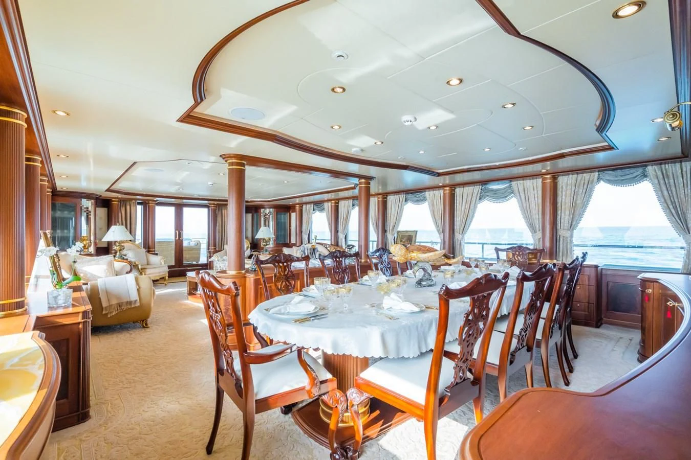 a dining room with a large table and chairs aboard AQUAMARINA Yacht for Sale