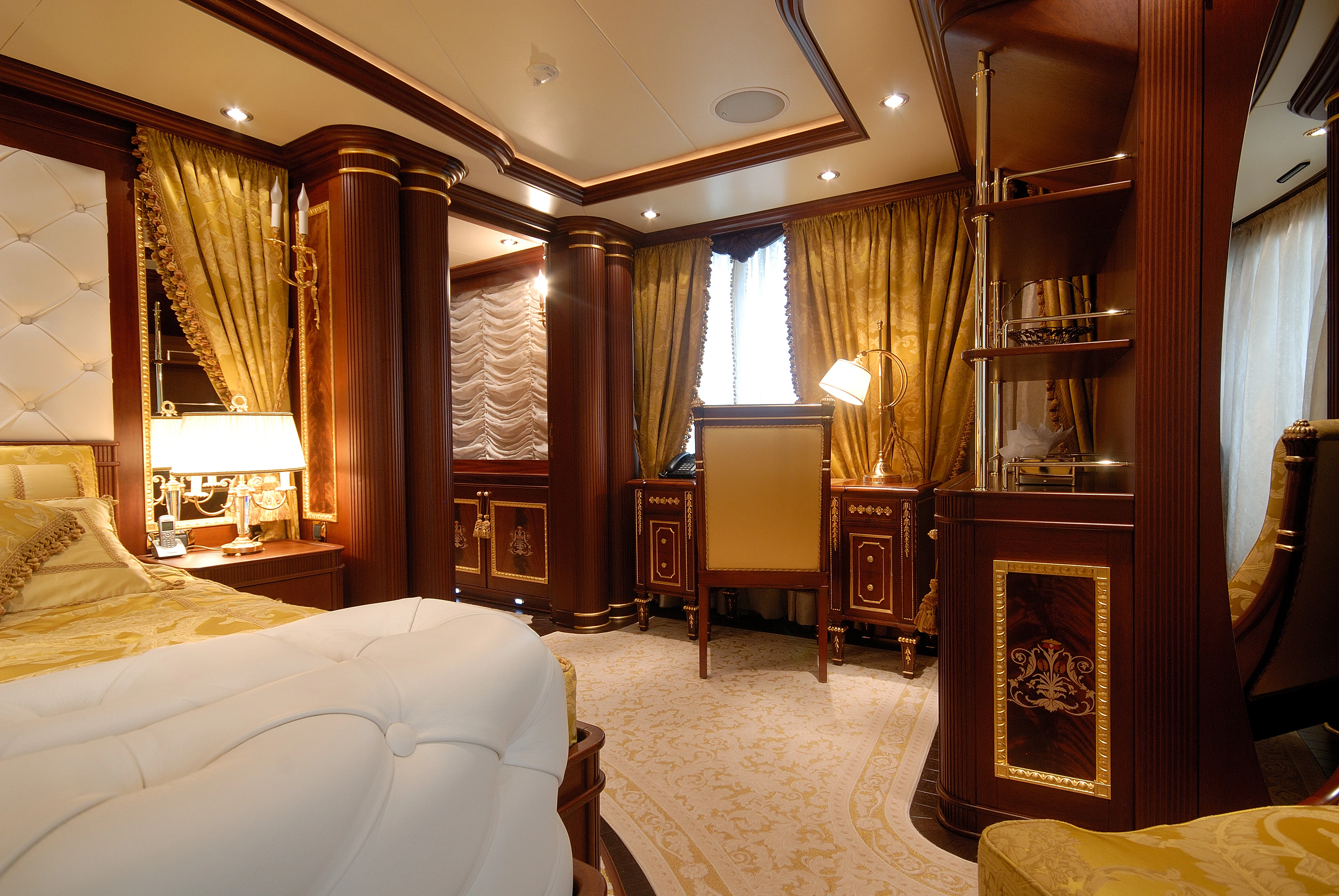 a room with a bed and a desk aboard AQUAMARINA Yacht for Sale