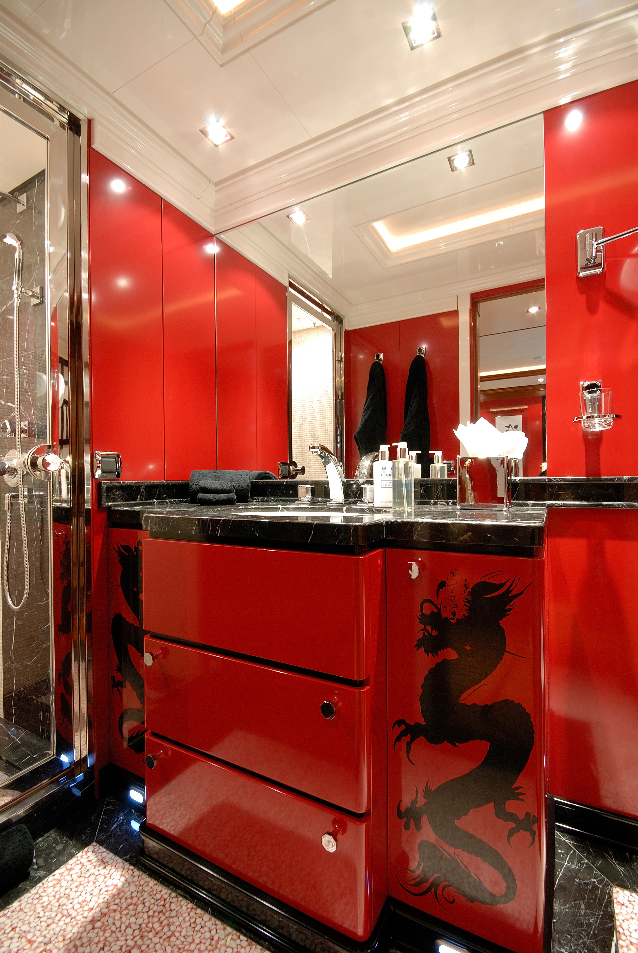 a bathroom with red walls aboard AQUAMARINA Yacht for Sale