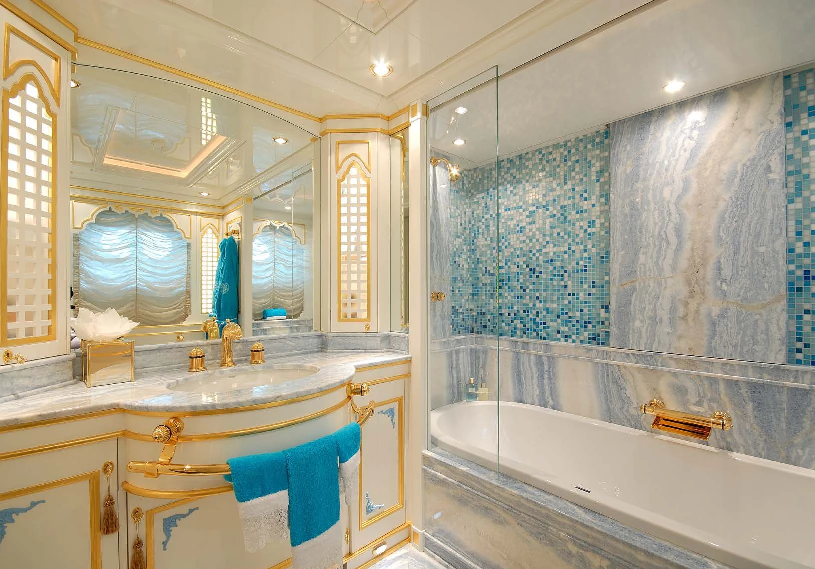 a bathroom with a tub sink and a mirror aboard AQUAMARINA Yacht for Sale