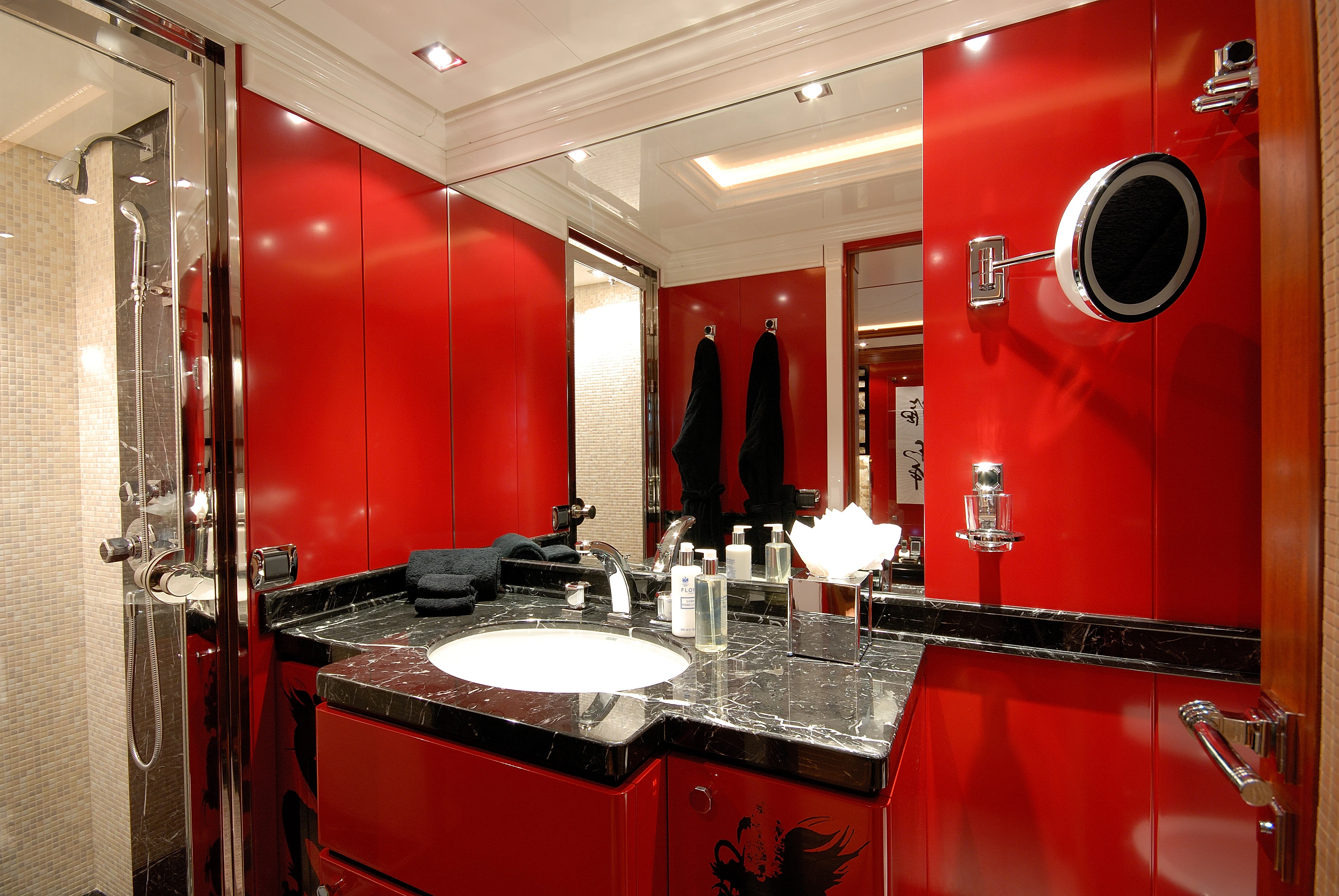 a bathroom with red walls aboard AQUAMARINA Yacht for Sale
