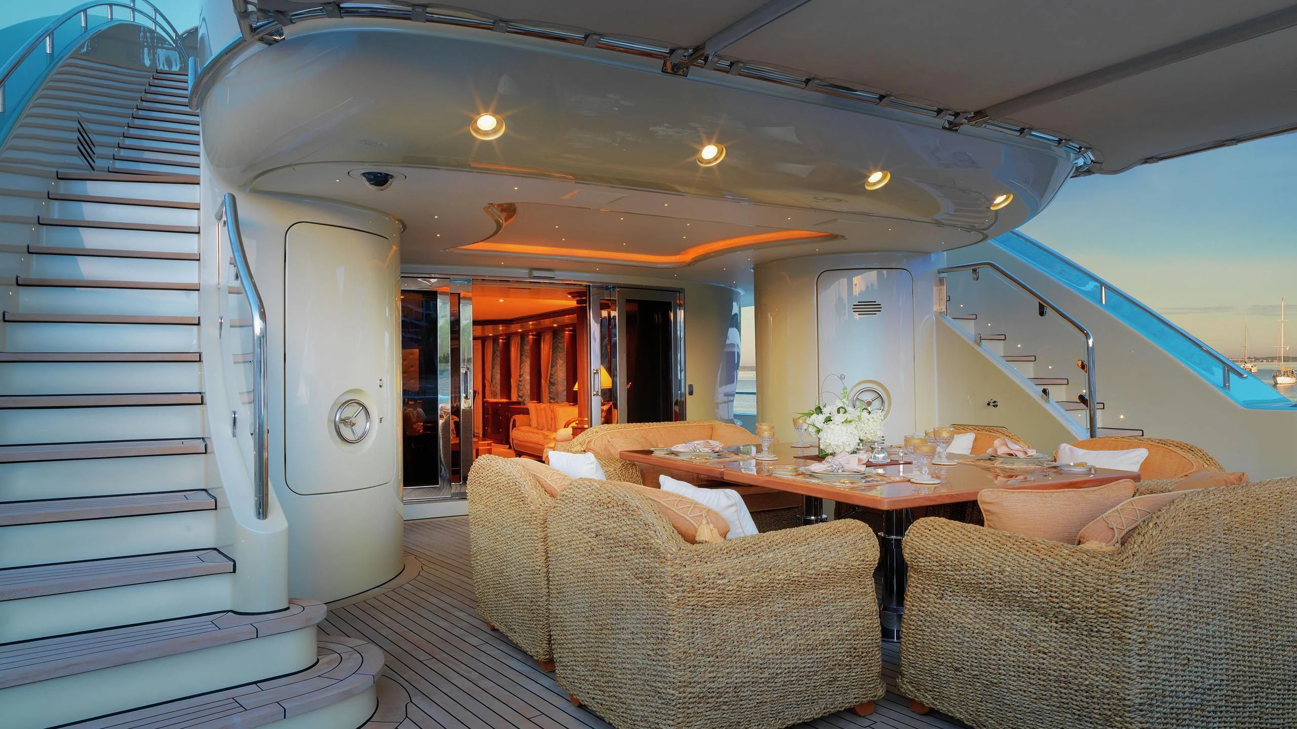 a room with a table and couches aboard AQUAMARINA Yacht for Sale