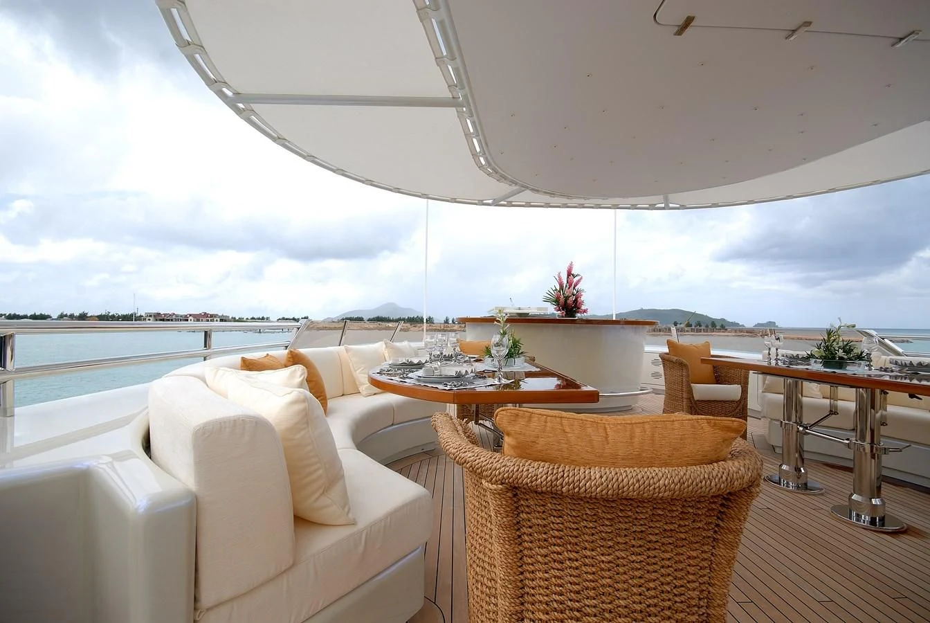 a room with a table and chairs aboard AQUAMARINA Yacht for Sale
