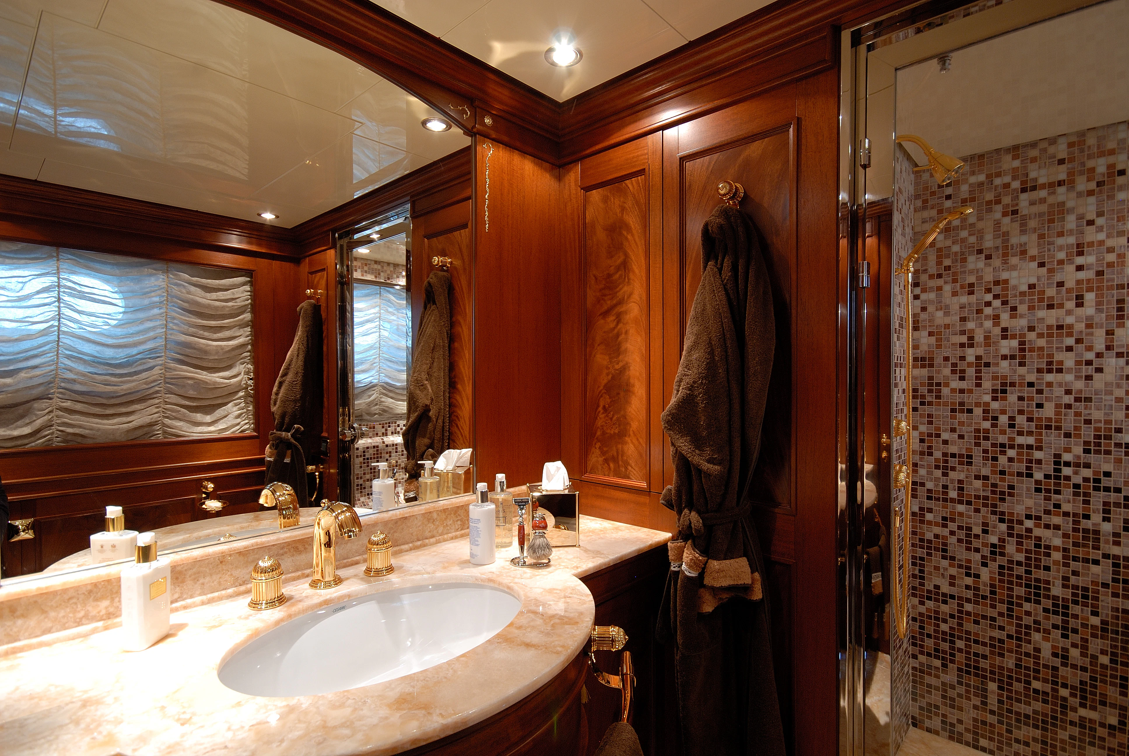 a bathroom with a sink and a mirror aboard AQUAMARINA Yacht for Sale