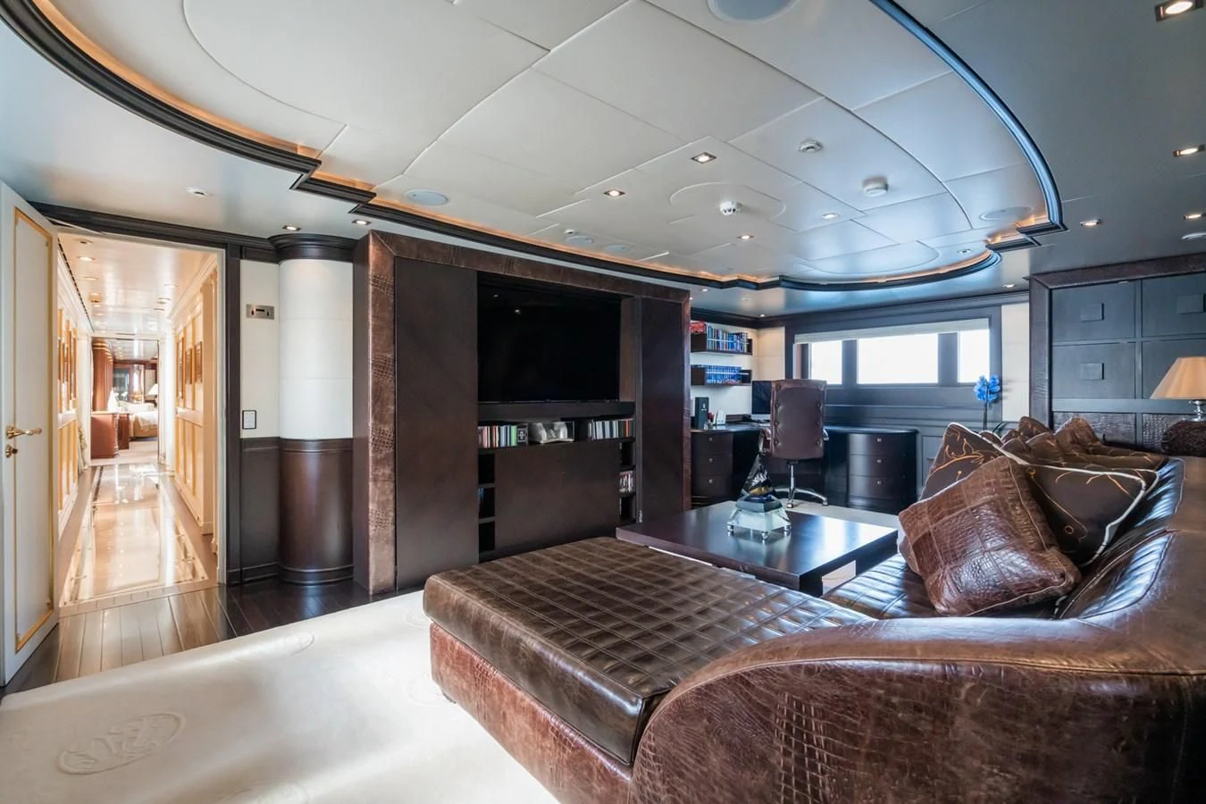 a living room with a couch and a table aboard AQUAMARINA Yacht for Sale