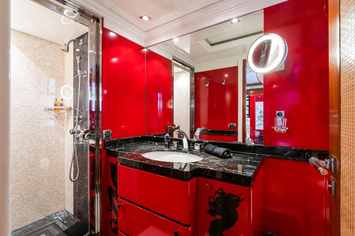 a bathroom with red walls aboard AQUAMARINA Yacht for Sale
