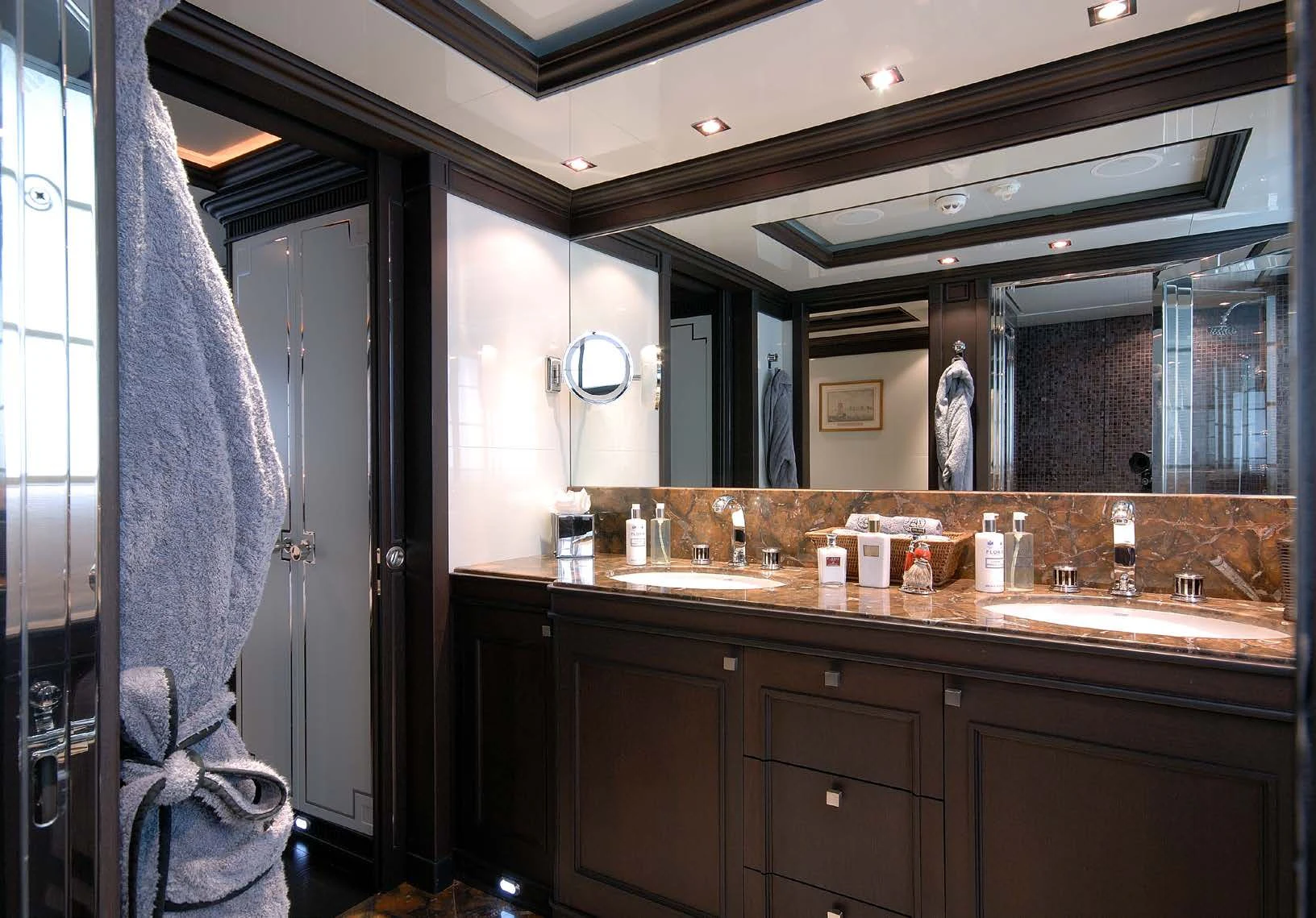 a bathroom with a countertop sink and a mirror aboard AQUAMARINA Yacht for Sale