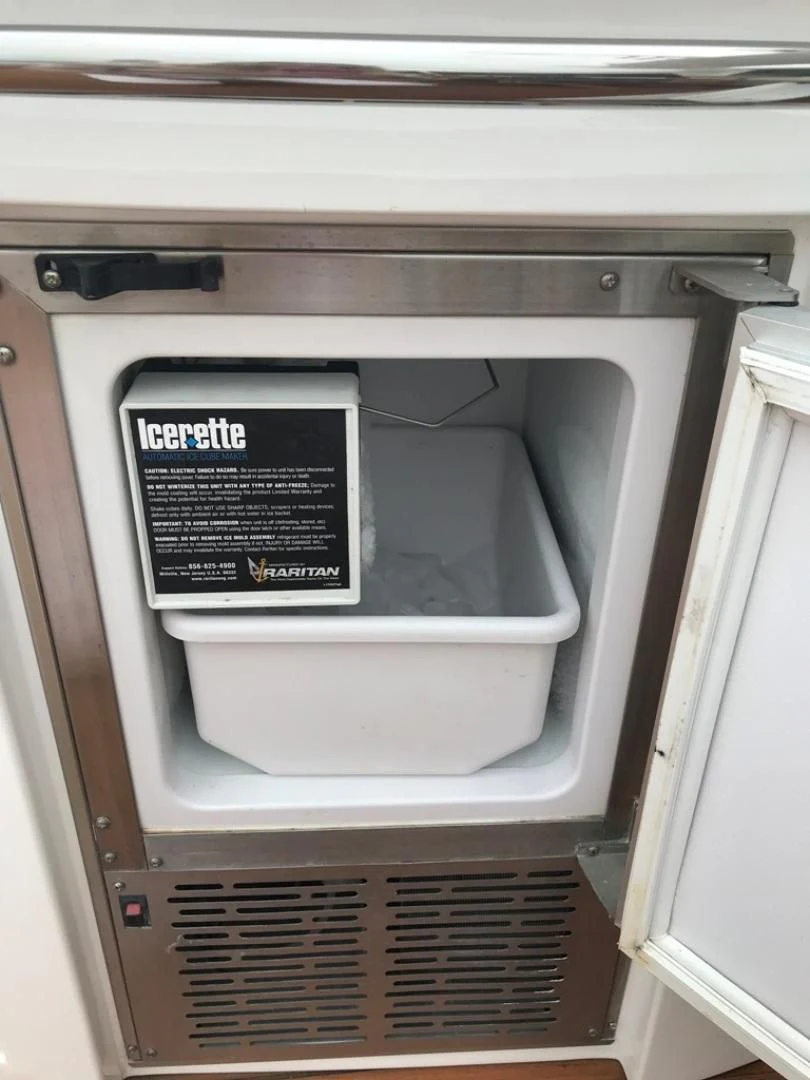 a white microwave with a sign on it aboard DAY DREAMER Yacht for Sale