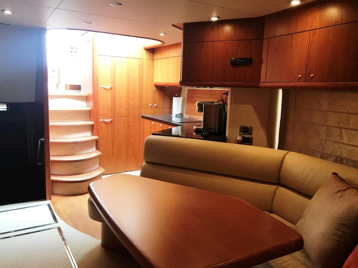 a living room with a staircase aboard DAY DREAMER Yacht for Sale