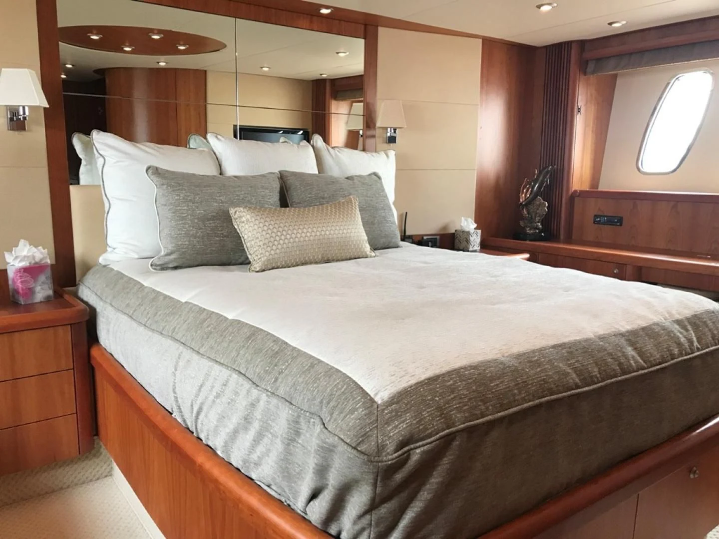 a bed with a large headboard aboard DAY DREAMER Yacht for Sale