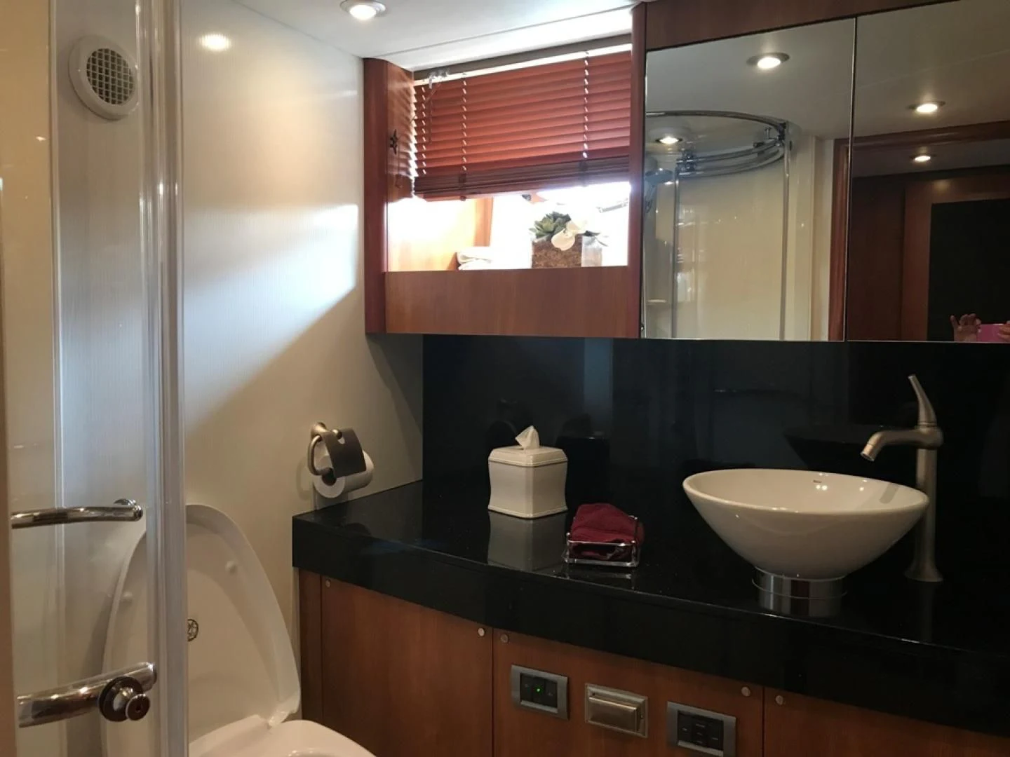 a bathroom with a sink and a mirror aboard DAY DREAMER Yacht for Sale