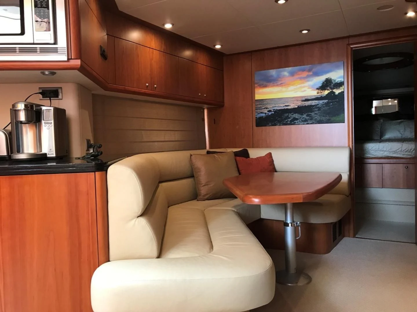 a living room with a table and chairs aboard DAY DREAMER Yacht for Sale