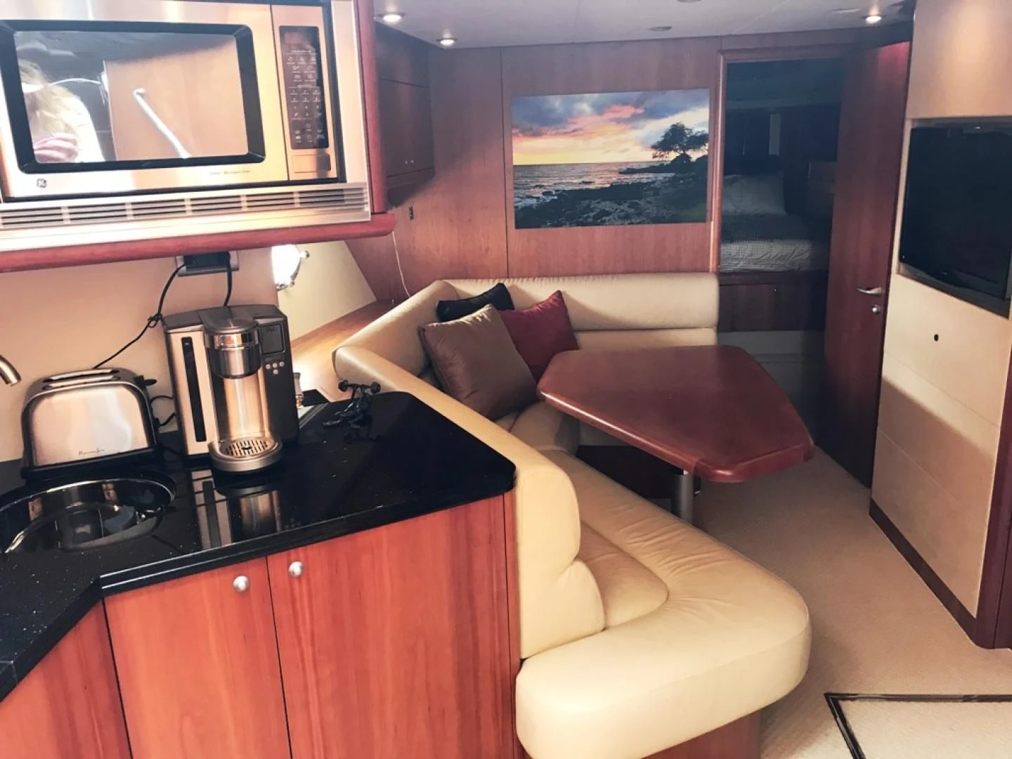 a living room with a couch and a coffee table aboard DAY DREAMER Yacht for Sale
