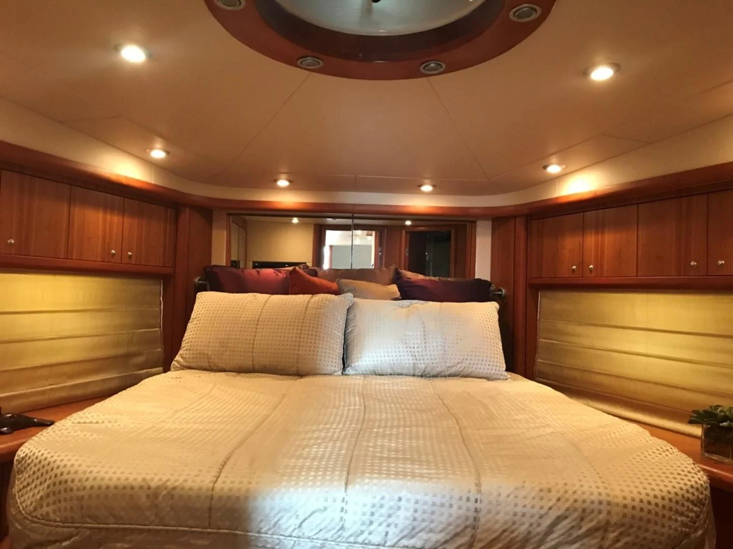 a bed with a white comforter aboard DAY DREAMER Yacht for Sale