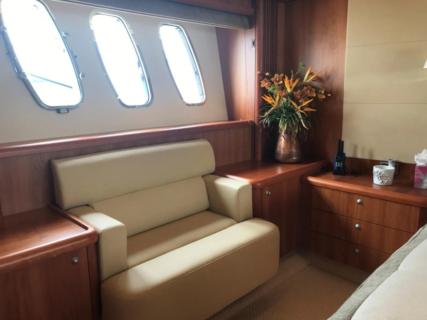 a room with a couch and a window aboard DAY DREAMER Yacht for Sale