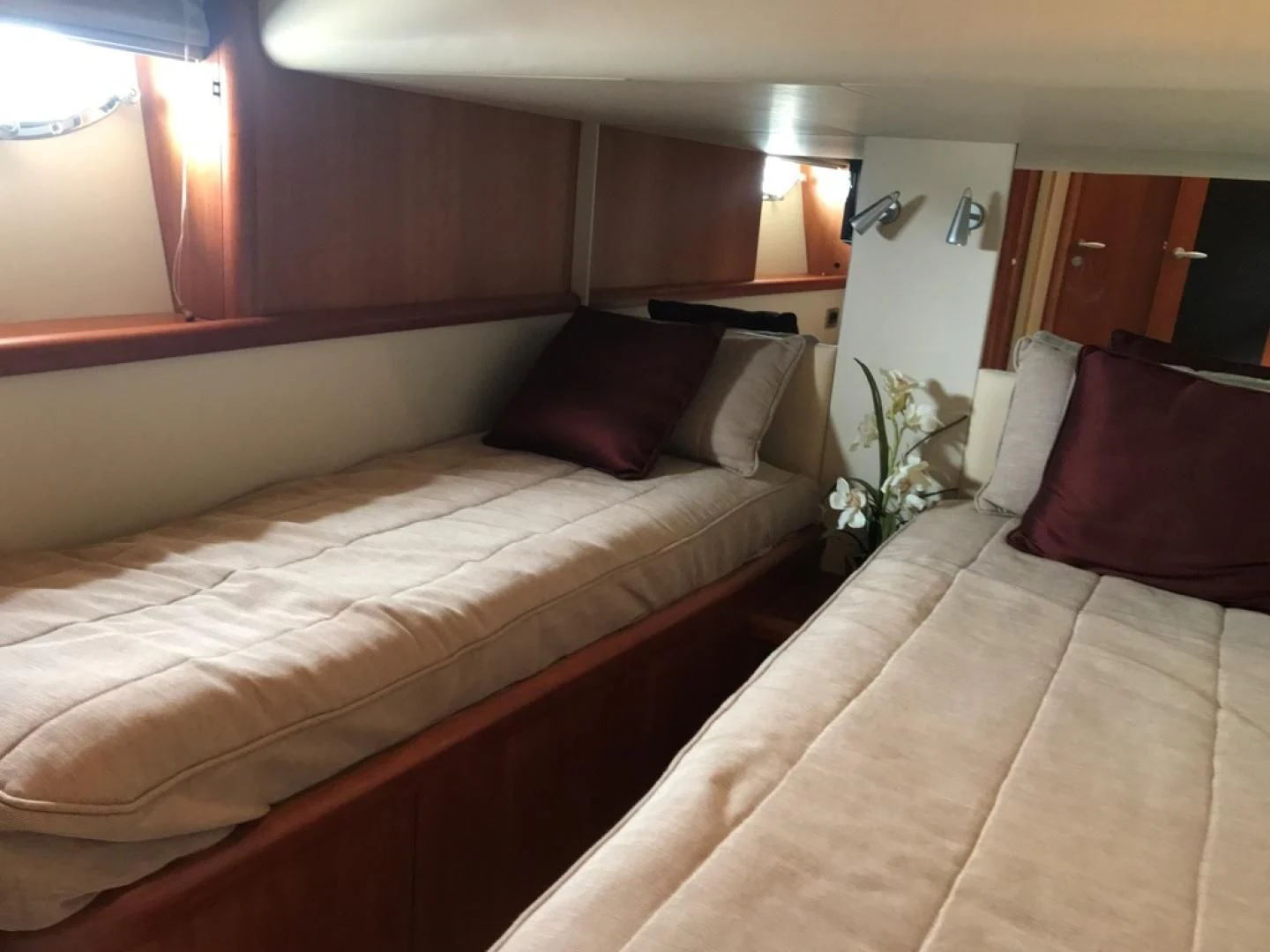 a bed with a flower on the side aboard DAY DREAMER Yacht for Sale