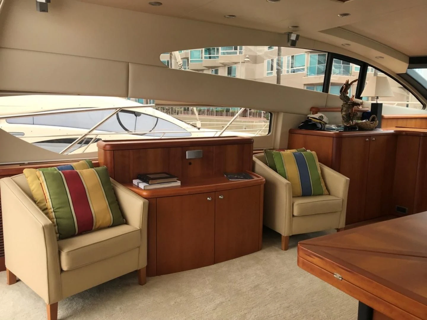 a room with a couch and a table and a chair aboard DAY DREAMER Yacht for Sale