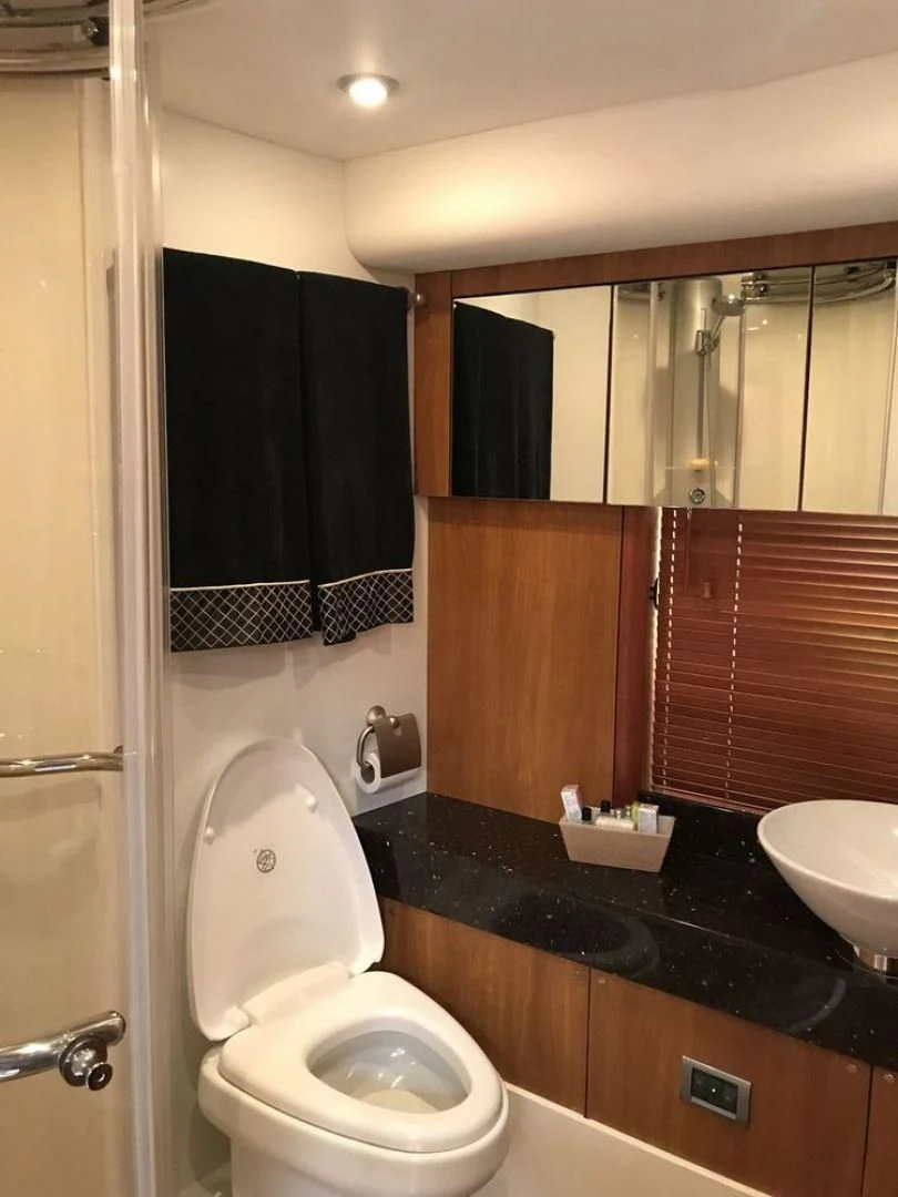 a bathroom with a toilet and sink aboard DAY DREAMER Yacht for Sale