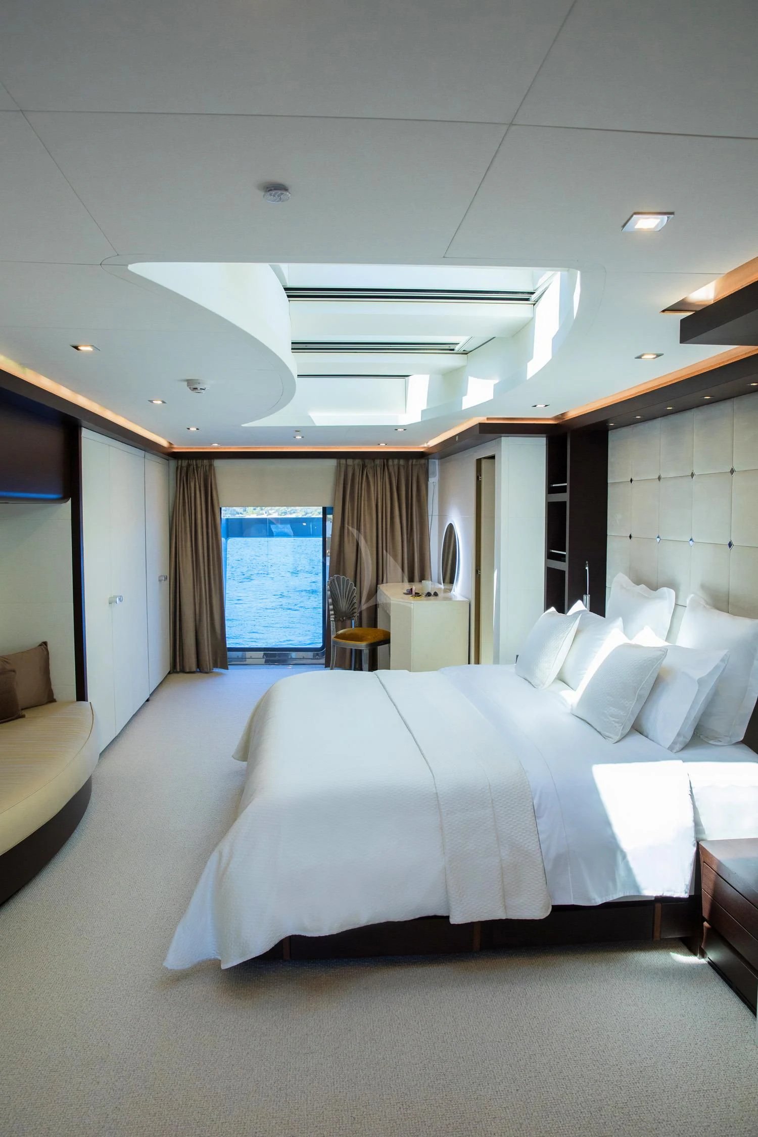 a large bed in a room aboard PERSEFONI I Yacht for Sale