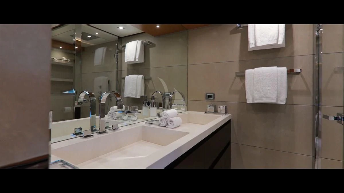 a bathroom with a large mirror aboard PERSEFONI I Yacht for Sale