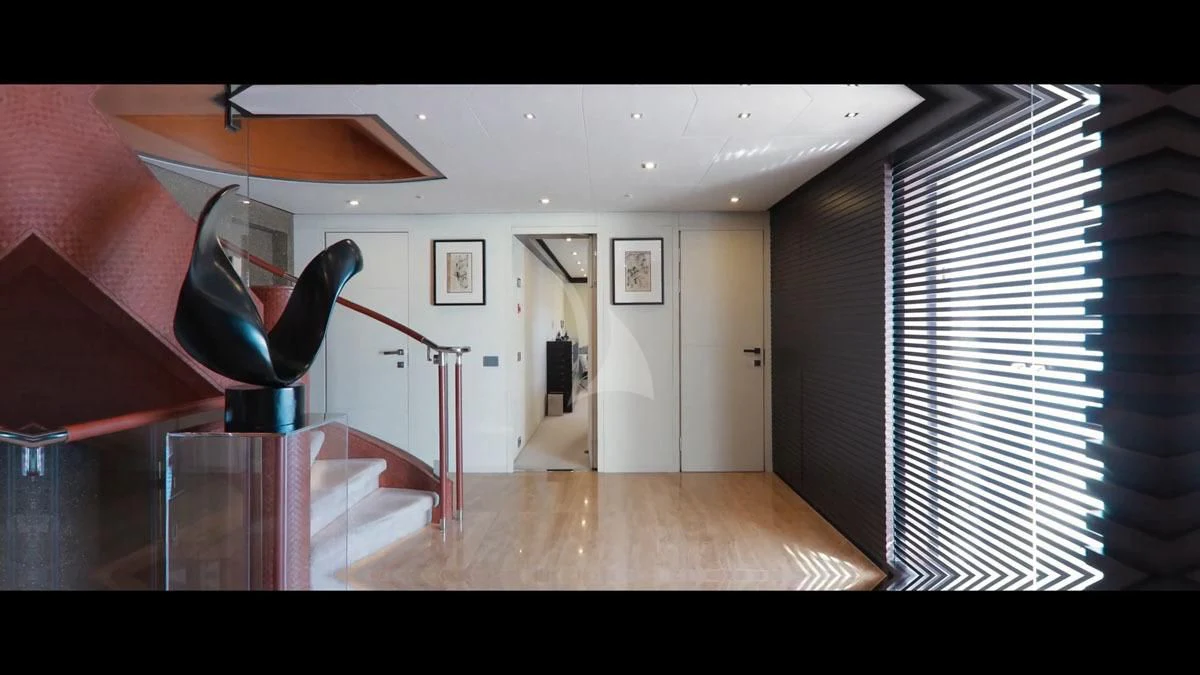 a room with a wood floor and a large mirror aboard PERSEFONI I Yacht for Sale