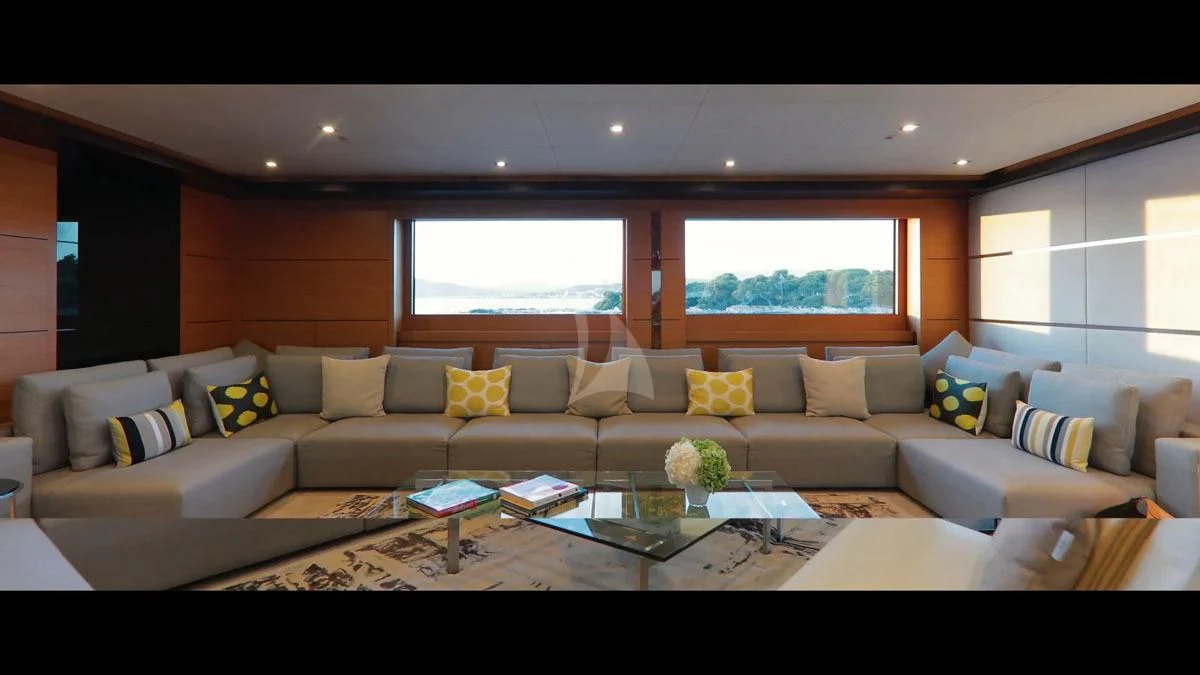 a living room with a couch and a coffee table aboard PERSEFONI I Yacht for Sale