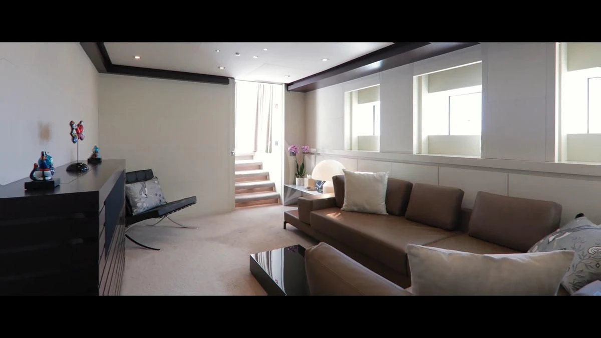 a living room with a couch and a table aboard PERSEFONI I Yacht for Sale