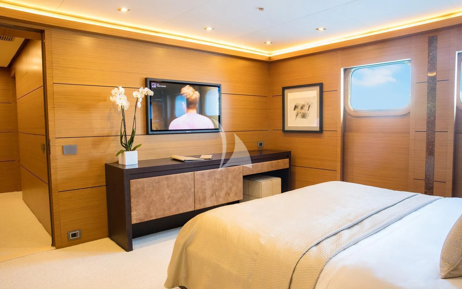 a hotel room with a large mirror aboard PERSEFONI I Yacht for Sale
