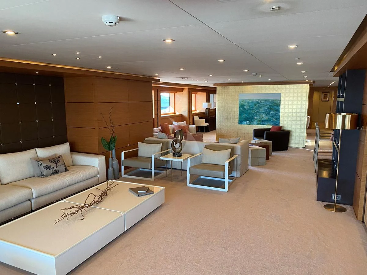 a living room with a couch and a tv aboard PERSEFONI I Yacht for Sale