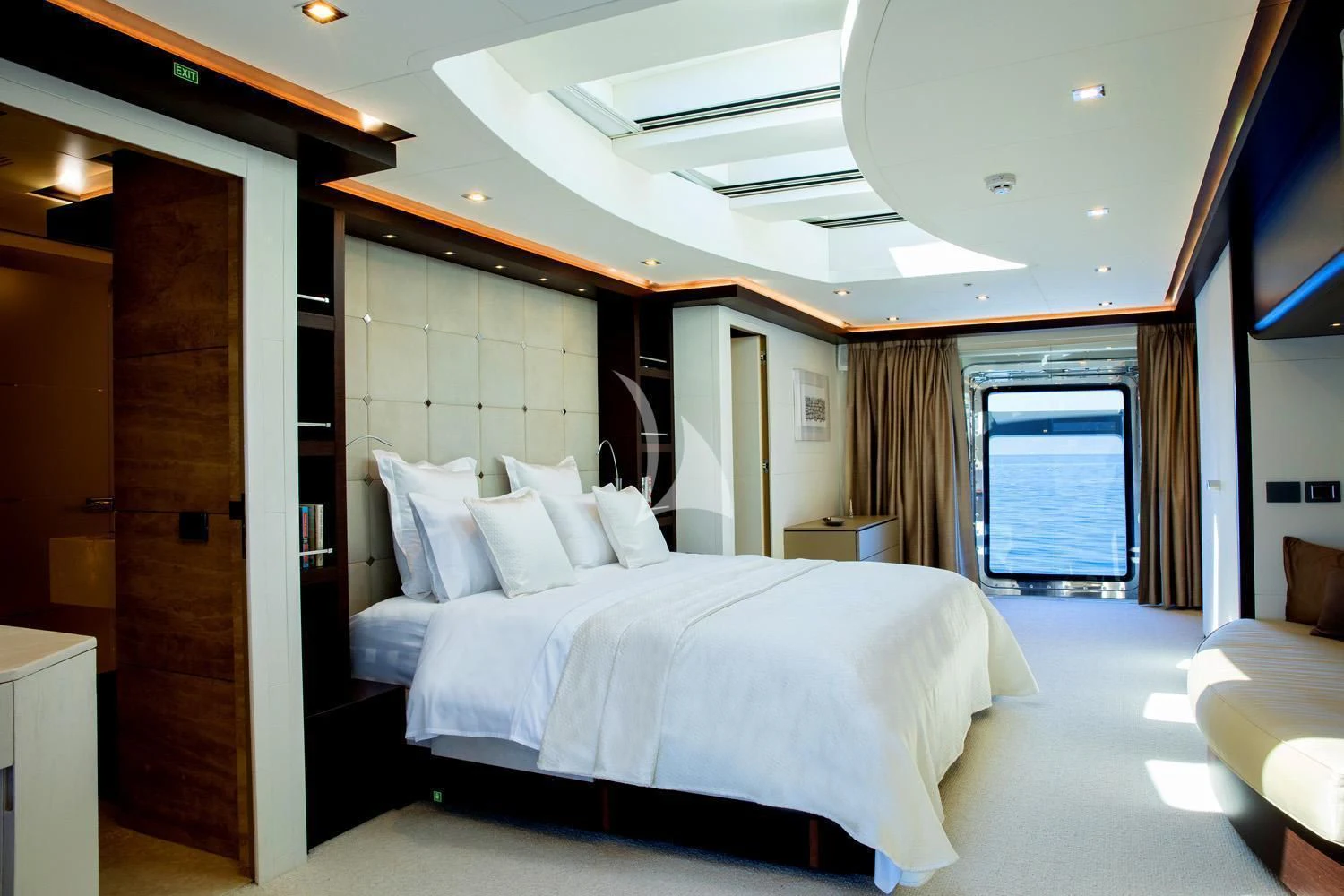 a room with a bed and a door aboard PERSEFONI I Yacht for Sale