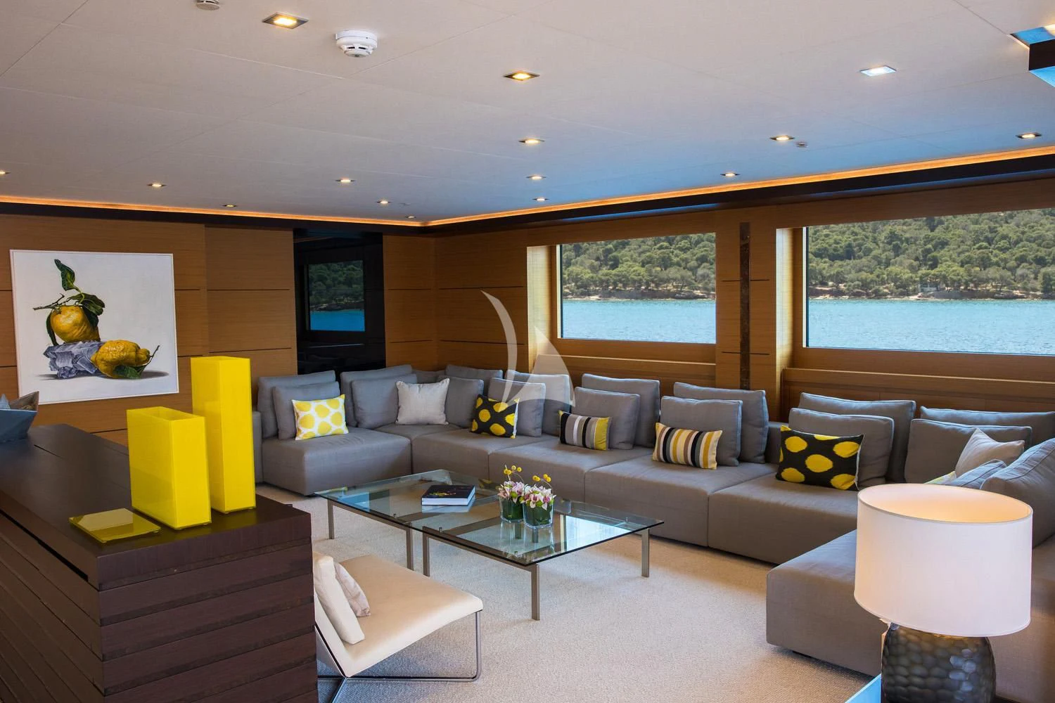 a living room with a couch and a coffee table aboard PERSEFONI I Yacht for Sale