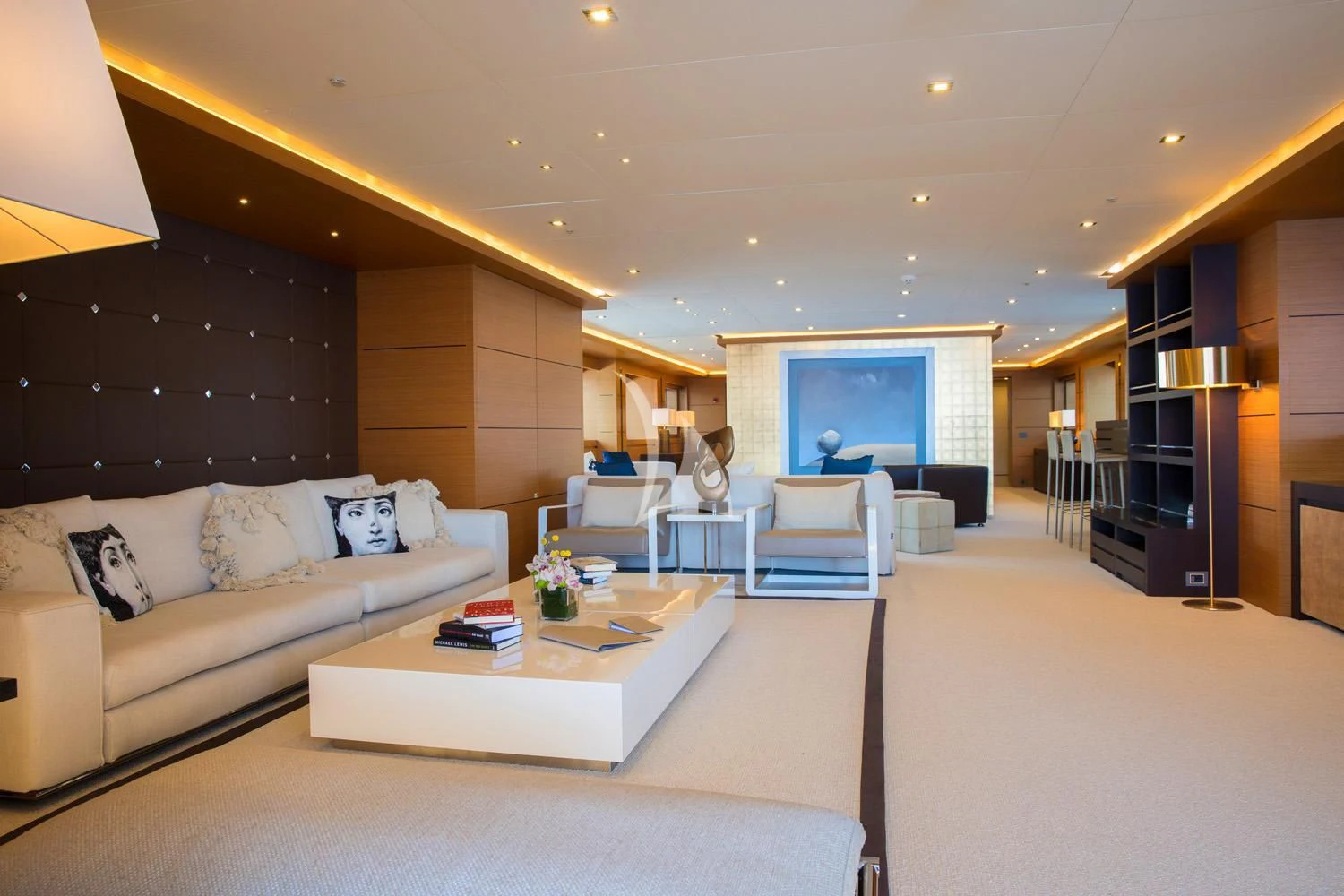 a living room with a white couch and a table aboard PERSEFONI I Yacht for Sale