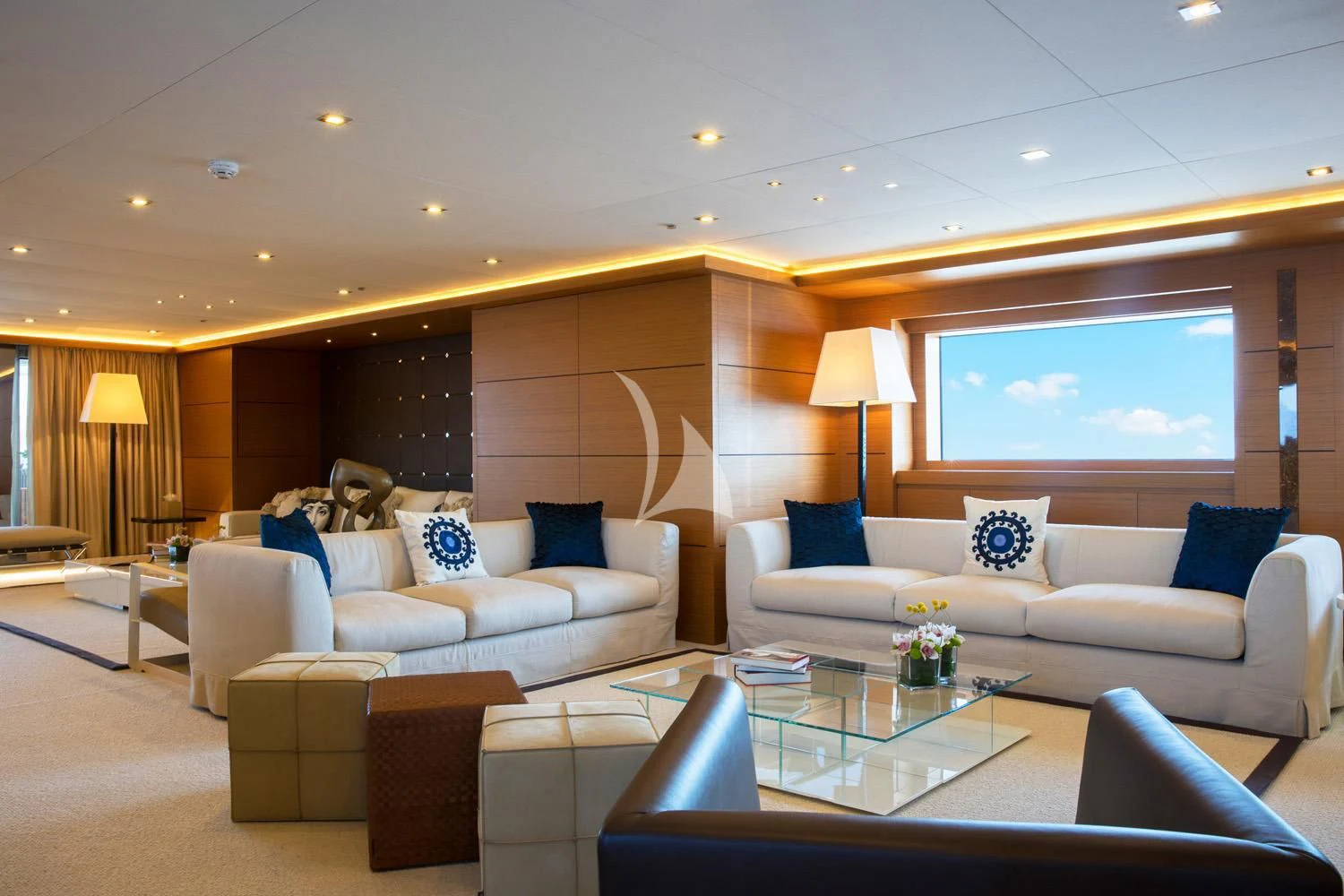 a living room with a large screen aboard PERSEFONI I Yacht for Sale