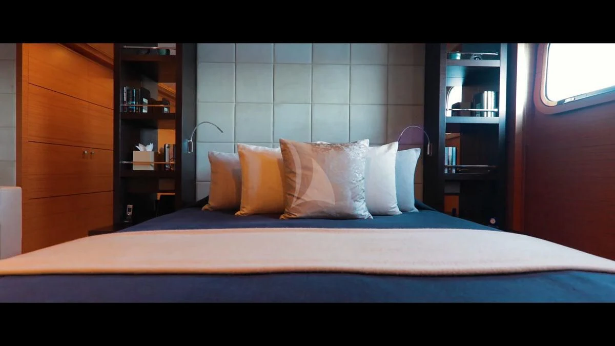 a bed with white sheets aboard PERSEFONI I Yacht for Sale