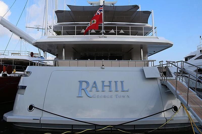 a large white boat with a red flag on the front aboard PERSEFONI I Yacht for Sale