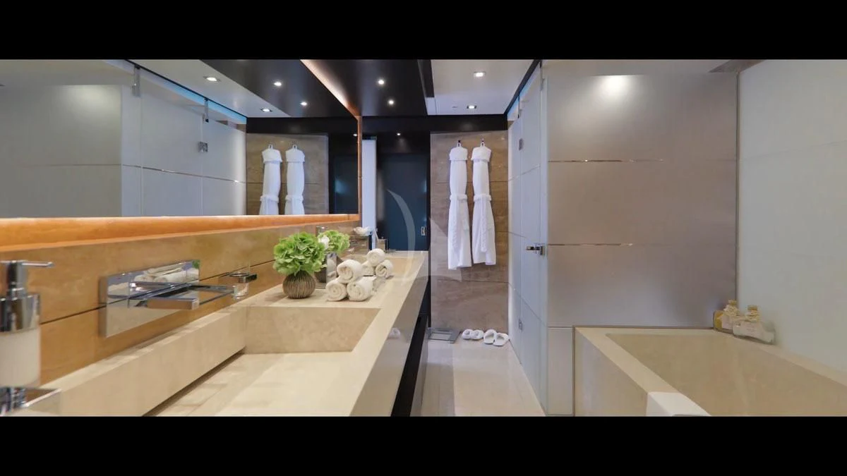 a modern bathroom with a large countertop aboard PERSEFONI I Yacht for Sale
