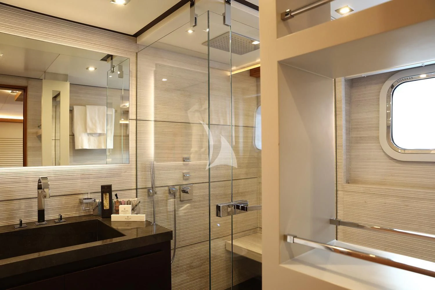 a bathroom with a glass shower aboard PERSEFONI I Yacht for Sale