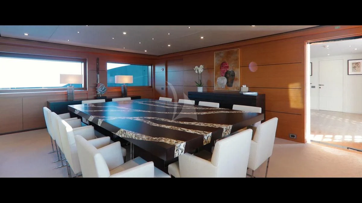a room with a table and chairs aboard PERSEFONI I Yacht for Sale