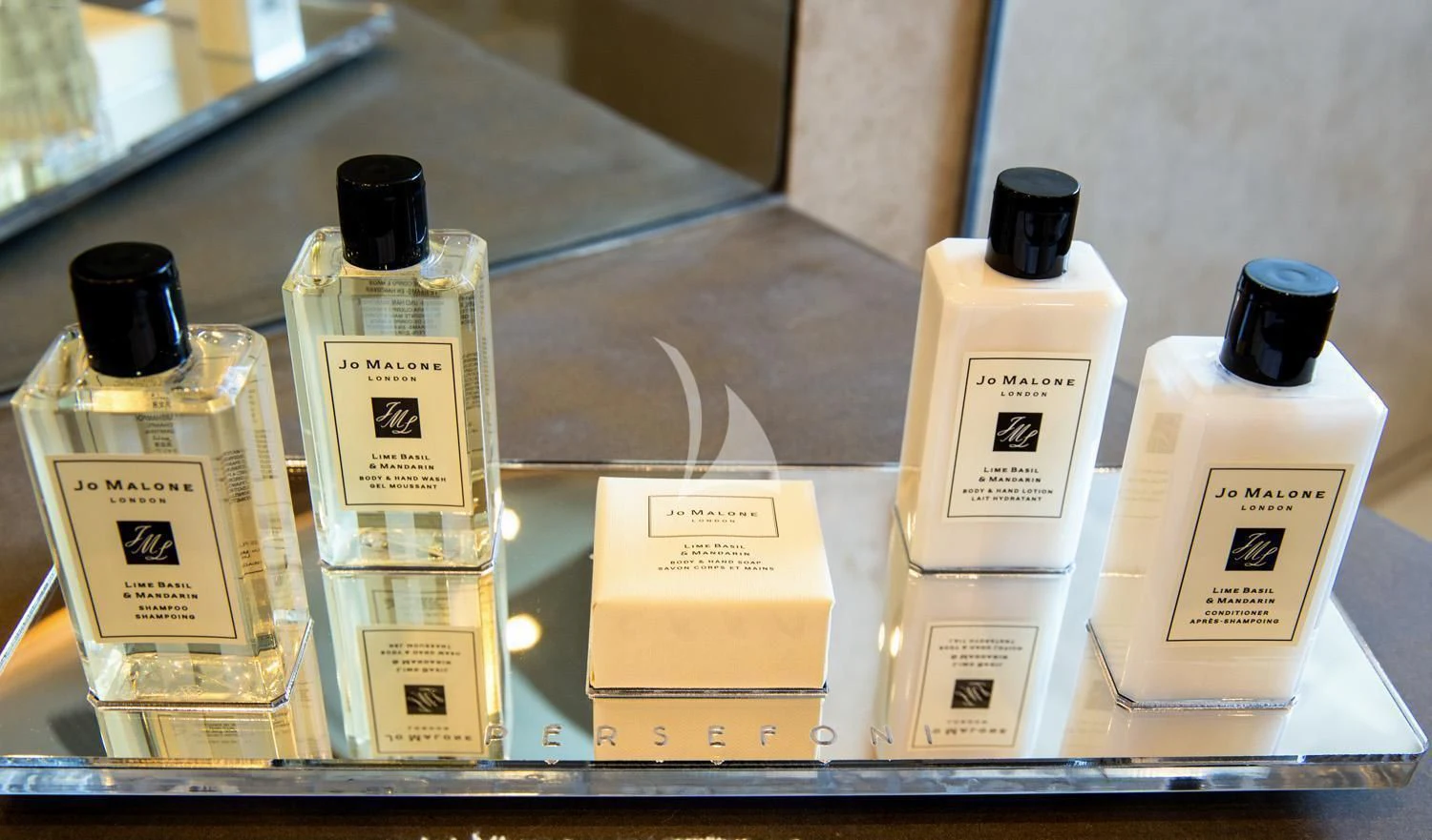 a shelf with bottles of perfume aboard PERSEFONI I Yacht for Sale