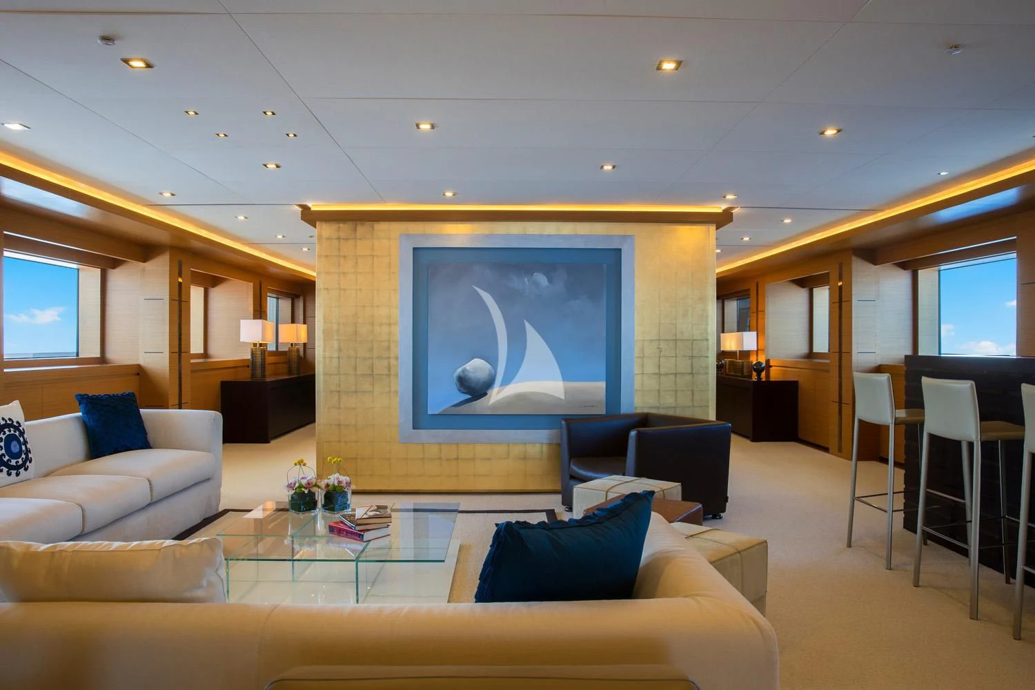 a living room with a large screen aboard PERSEFONI I Yacht for Sale