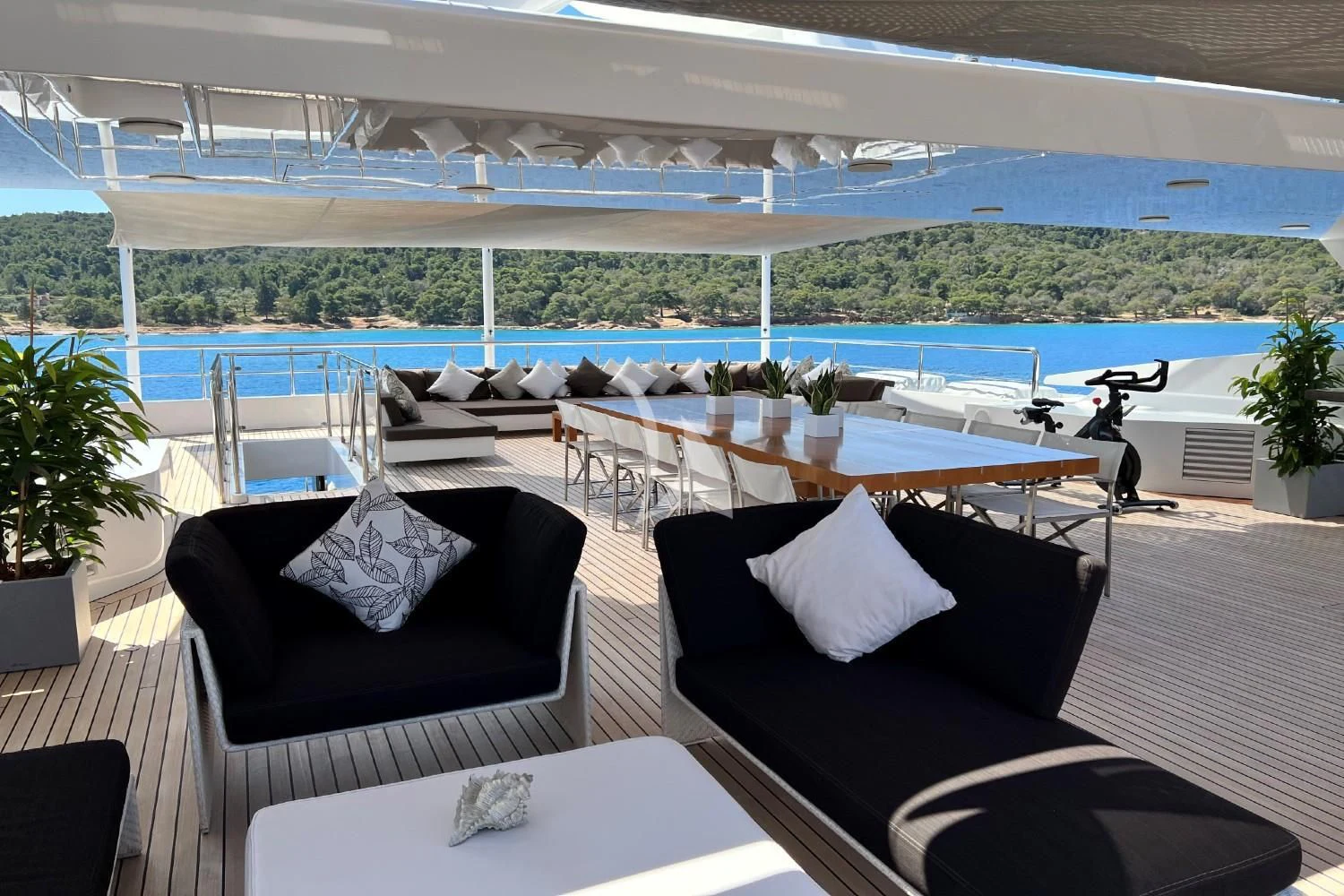 a room with a table and chairs aboard PERSEFONI I Yacht for Sale