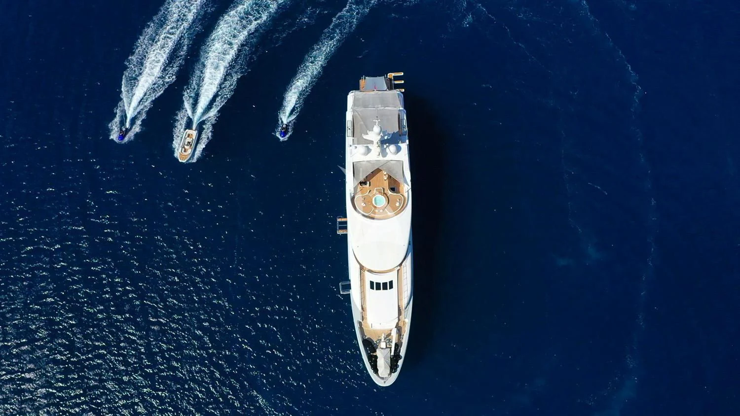 a white and black ship on a blue background aboard PERSEFONI I Yacht for Sale